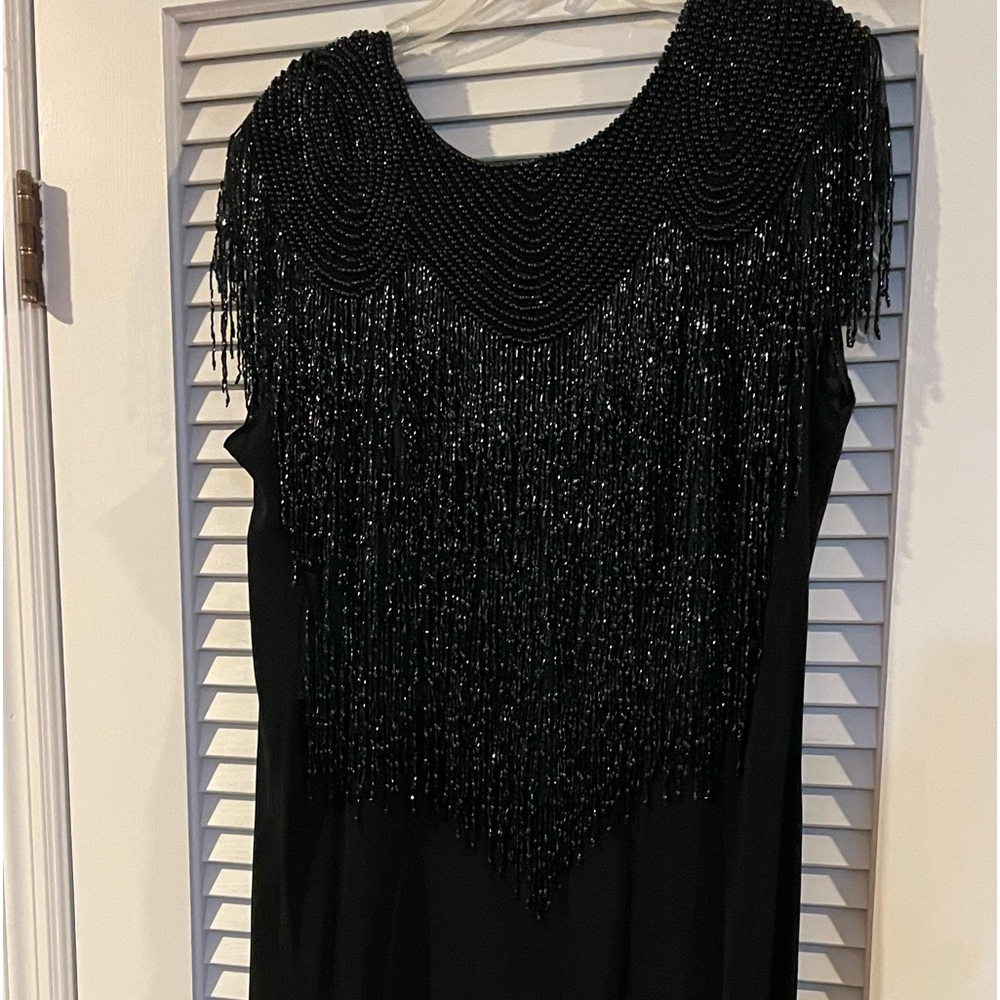 Black gown trimmed with beads